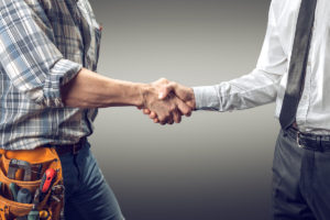 handshake between homeowner and contractor